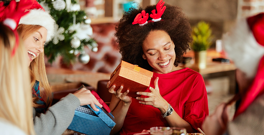 Woman opening christmas present