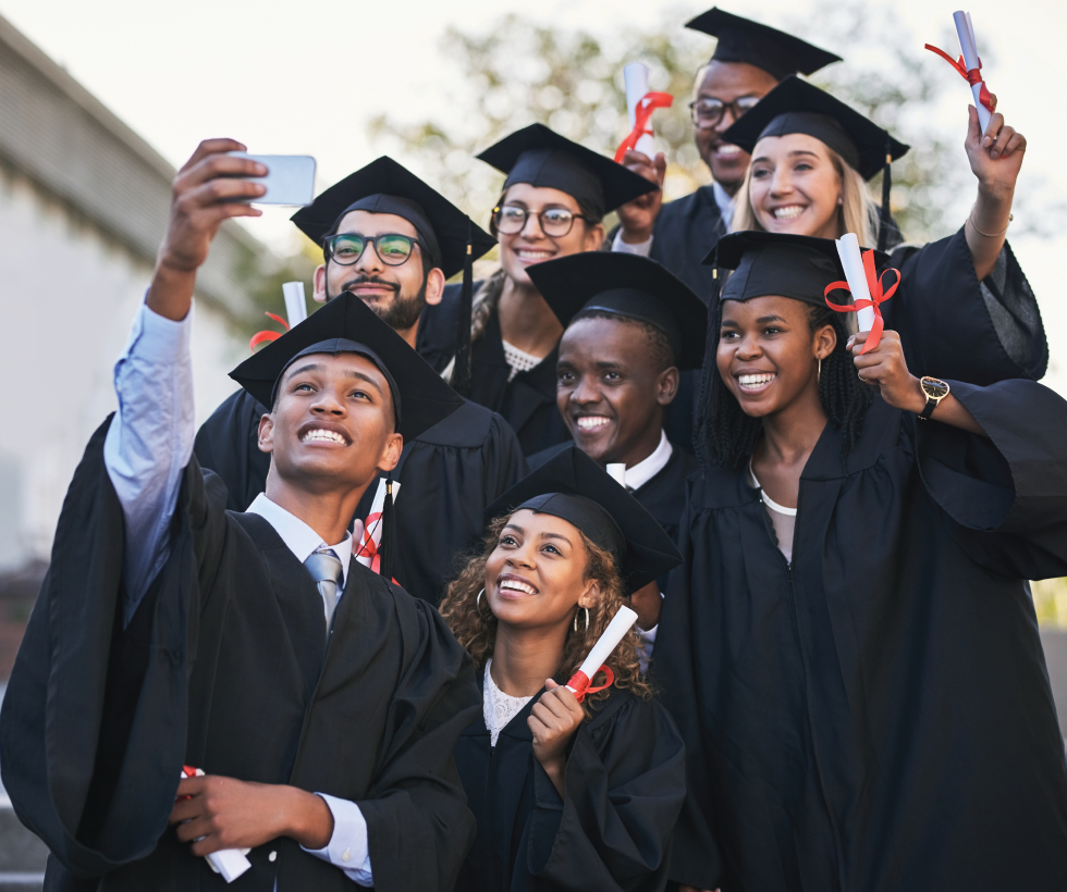 group of graduating college students taking a selfie