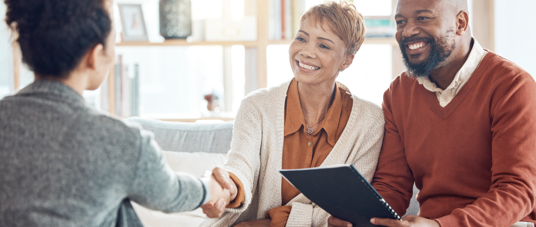 Couple meeting with financial advisor at home