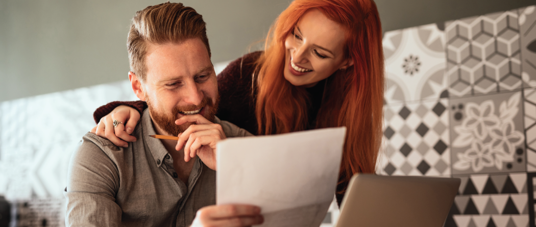 Couple reviewing paper application