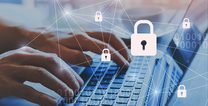 Hands typing on a laptop overlaid with padlock icons connected by network lines.