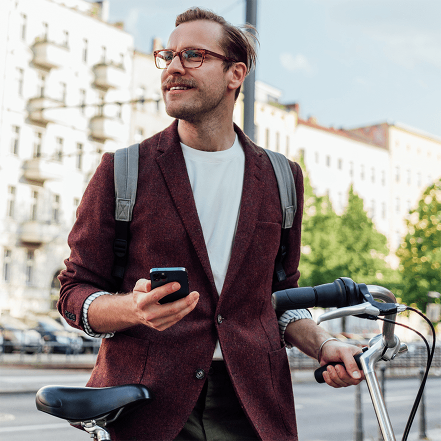 man in city with bike